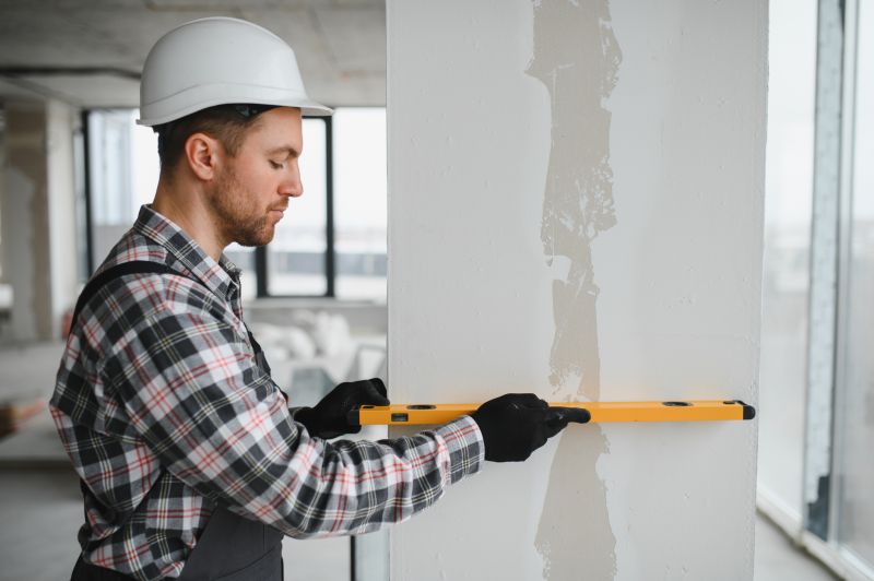 Construction Worker with Drywall Tools